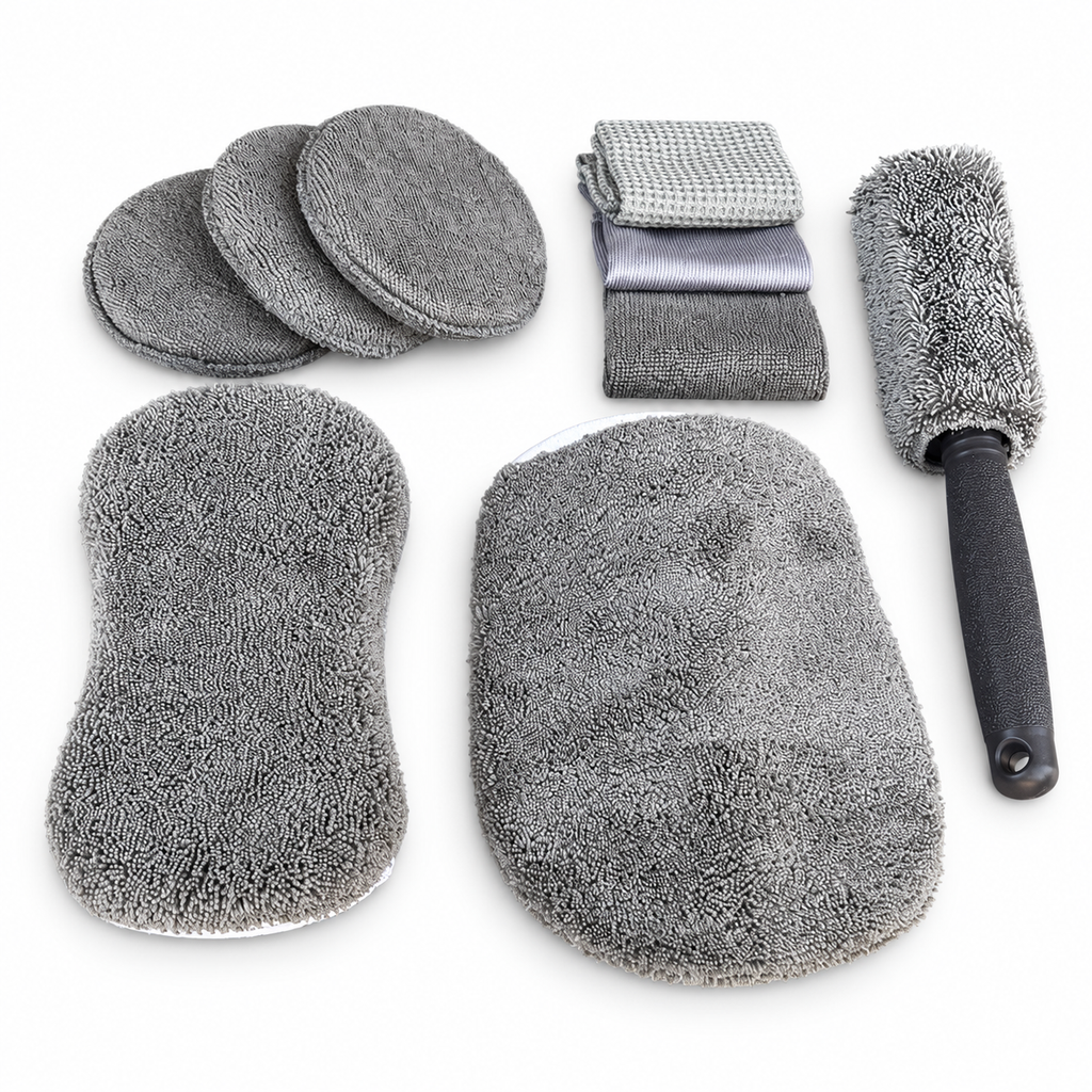 Nine-piece grey microfibre car wash kit laid out on a white background