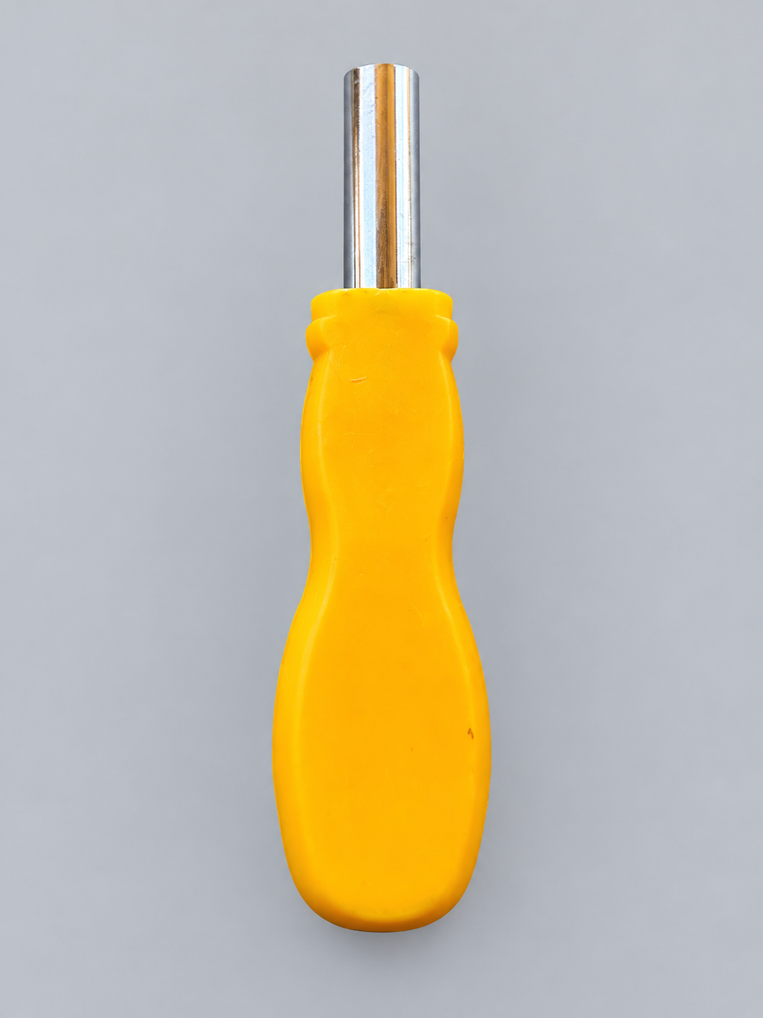 Yellow screwdriver handle with metal bit socket