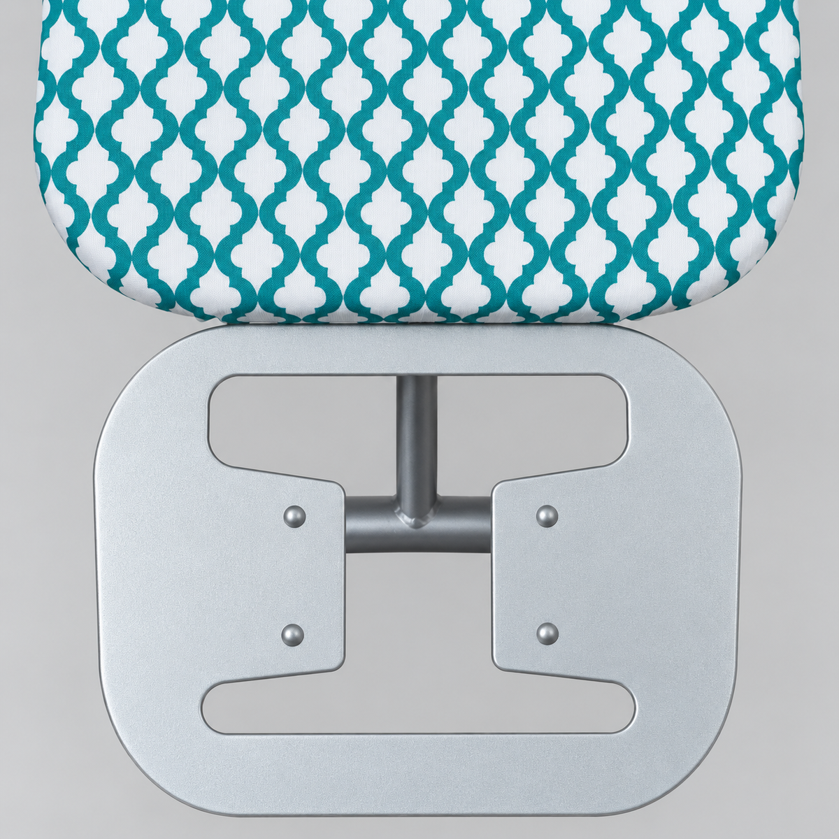 SMTE ironing board with green and white patterned cover and iron rest